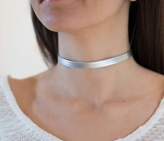 "silver Choker Necklace, Tattoo choker Necklace, Faux Leather Choker, Dainty Choker Necklace, Boho Chic Choker, Neck Choker, Silver Choker I LOVE this Faux Leather Silver choker necklac , this choker is a MUST have for your wardrobe , this necklace is perfect for any kind of weather time or type of women .We ladies love to keep it simple and trendy. Unless stated otherwise, the length of our chokers band is 11\"-12\" inches and includes a 3\" inches Silver/Gold Plated chain extender attached for Gold Neck Choker, Tattoo Choker Necklace, Necklace Tattoo, Choker Necklace Silver, Dainty Choker Necklace, Tattoo Choker, Choker Silver, Dainty Choker, Silver Choker Necklace