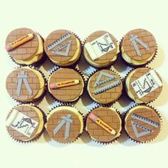 cupcakes decorated with different types of construction related items