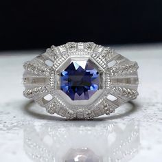 a blue and white ring sitting on top of a table