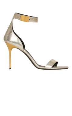 Crafted to a dramatic stiletto silhouette, these Uma sandals boast a lizard-skin effect and are completed in a gold-tone hue.Lizard-skin effectMetallic finishOpen toeSquare toeBuckle-fastening ankle strapHigh stiletto heel 4"Composition: Lambskin 100%Sole: Leather 100%Lining: Leather 100%Made in Italy Metallic Pointed Toe Sandals For Evening, Luxury Metallic Sandals For Gala, Metallic Pointed Toe Evening Sandals, Gold Sandals With Reinforced Heel For Evening, Modern Gold Sandals With Reinforced Heel, Luxury Metallic Sandals For Formal Occasions, Metallic Sandals With Sculpted Heel For Formal Occasions, Formal Metallic Sandals With Sculpted Heel, Chic Metallic Sandals With Sculpted Heel