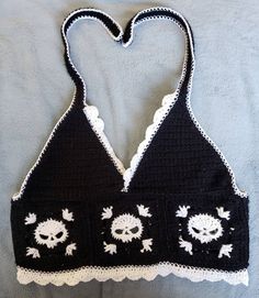 CROCHET Granny Square Skull Halter Top.  Slightly different design than my other etsy halter tops.  Made without darts in bra cups.  This fits better for flat chested people.  More cropped.  I can make any of my granny squares into either style of top.  Fits most that wear small, med, & large  women's. Machine wash cold on delicate cycle, air dry. Gothic Crochet Top, Crochet Skull Top, Granny Square Crochet Pattern Clothes, Crochet Top Goth, Goth Crochet Top, Cute Crochet Clothes, Halloween Crochet Top, Skull Granny Square