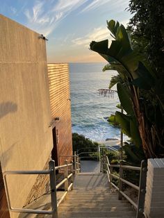 the stairs lead down to the beach where there is no one in sight or anything else