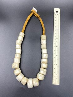 Old ancient African shell beaded necklace Traditional Adjustable Shell Necklace, Vintage Shell-shaped Beaded Necklaces, Vintage Beaded Shell Necklaces, Traditional Handmade Beige Jewelry, Vintage Handmade Shell Necklaces, Handmade Vintage Shell Necklaces, Vintage Handmade Shell Necklace, Traditional Beaded Beige Jewelry, Adjustable Traditional Cream Jewelry