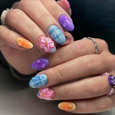 A dreamy combination of pastel shades and floral accents, this manicure features a spectrum of colors from soft purples and blues to gentle oranges and pinks. The nails are adorned with intricate flower designs and subtle water droplet details, adding depth and texture. The glossy finish and smooth, oval shape make this design perfect for a whimsical summer look.@pauletteenails Easy Halloween Nails Design, Soft Pink Nails, Black Halloween Nails, Summer Nail Ideas, Halloween Nails Easy, Perfect Manicure, Manicure Inspiration, Nail Pops, Classic French Manicure