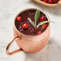 a copper mug filled with cranberry punch