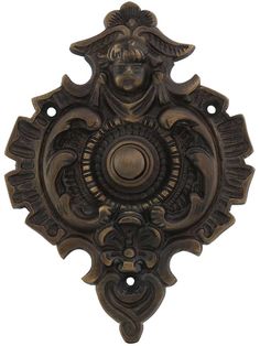 an ornate door handle with a woman's face on it