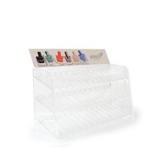 a clear acrylic display case with five nail polishes in it and four different colors on each shelf