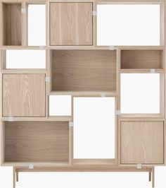 an open bookcase with wooden shelves and white labels on the doors, all stacked together