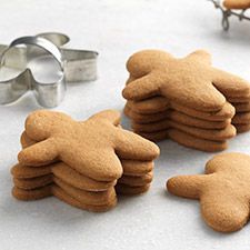 some cookies and cookie cutters on a table