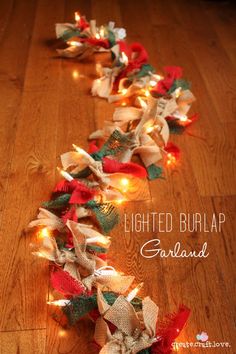 some lights are on the floor and there is a garland that has been made from burlap