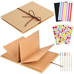 several different types of crafting supplies including notebooks, pens and paper with colored dots on them