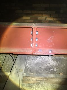 the back end of a red metal object