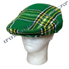 An Irish Green Tartan Flat Cap, also known as a gentleman's hat, is a classic and stylish headwear option. This type of cap typically features a distinctive Irish tartan pattern in shades of green, giving it a traditional and eye-catching appearance. It's designed to be one-size-fits-all, often with a velcro fitting mechanism, allowing for easy and adjustable wear to ensure a comfortable fit. The flat cap is a versatile accessory that adds a touch of Irish heritage to one's attire, making it suitable for various occasions, from casual outings to more formal events. Its combination of traditional design and modern convenience with the velcro fitting makes it a popular choice for those looking for both style and comfort in their headwear. black good quality of lining inside and adjustable ve Classic Green Hat One Size Fits Most, Green Flat Brim Hat, One Size Fits Most, Classic Green Hat With Flat Brim, Classic Green Flat Brim Hat, Vintage Green Hat, Retro Green Brimmed Hat, Retro Green Hat With Short Brim, Green Retro Hat With Short Brim, Casual Green Brimmed Mini Hats