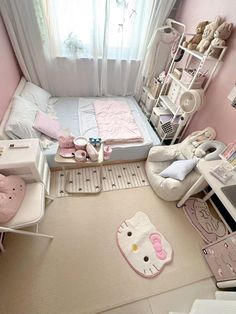 a bedroom with hello kitty decor and furniture