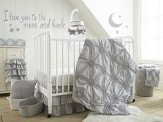 a baby crib bedding set with stars and moon prints