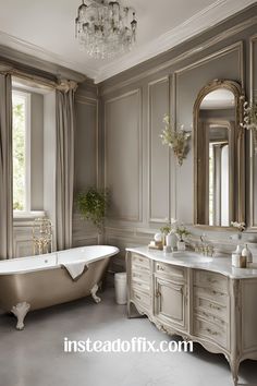 a bathroom with a claw foot tub and chandelier in the middle of it