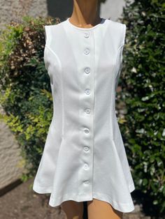 Here is a vintage 1970s Polyester Tennis Dress.Made by Head.Following are the measurements. Bust 34",Waist 30",Hips full,Length measured from top of shoulder to hem 28".Buttons up the front.White polyester fabric.Full pleated skirt.In very nice vintage condition. Please take special consideration of measurements. 1970 sizing was much smaller than today's standards. Take extra special note of length. Tennis dresss were very short not like a regular dress.If you live overseas please email me first before purchasing for mailing cost. Price quoted is for USA only Vintage Tennis Dress, 70s Mode, White Tennis Dress, Collection Ideas, 60s And 70s Fashion, Vintage Tennis, Womens Sports, Tennis Dress, 70s Fashion