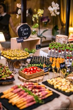 an assortment of food is displayed on a table