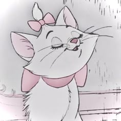 an animated image of a cat with a bow on it's head and eyes closed