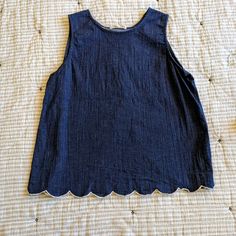 An Og From Stitch Fix, This Top Is Sure To Dazzle! All Over Chambray Construction With White Embroidered Scallop Hem Which Continues To A Split Back. This Top Is In Excellent Condition. Not Nwt, But Never Worn. Falls Into An A-Line Fit. Women's Size Large. Indigo Sleeveless Top For Spring, Casual Spring Tops With Scalloped Edges, Casual Tops With Scalloped Edges For Spring, Sleeveless Indigo Tops For Spring, Summer Cotton Tops With Scalloped Edges, Fitted Cotton Tops With Scalloped Edges, Spring Cotton Top With Scalloped Edges, Cotton Tops With Scalloped Edges For Spring, Navy Cotton Tank Top For Spring