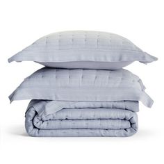 three pillows stacked on top of each other