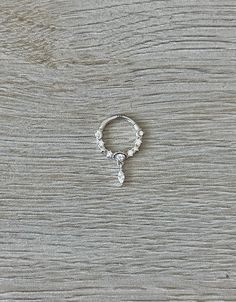 "This septum piercing is made of 14K gold, with CZ crystals. and moon and star designs. This is a great, dainty but sparkly everyday option, that you can put in and leave in!  Available in 8mm or 10mm inner diameter options. Available in white gold or yellow gold. Piercing \"clicks\" into place. Super dainty minimalist look - drop jaws with this body jewelry! This clicker can be used for many piercings, including septum rings, daith earrings, cartilage hoops, conch rings, etc. **PACKAGE INSURANCE: Please either upgrade to priority express shipping at checkout if you would like to insure your package OR you can also purchase insurance separately Insurance up to $100 for $1.50 here:  https://www.etsy.com/listing/1296961518 Insurance up to $200 for $2.00 here: https://www.etsy.com/listing/131 Gift Diamond Accented Round Piercings, Elegant White Gold Nose Rings In Sterling Silver, Silver Teardrop White Topaz Jewelry, Elegant White Gold Sterling Silver Nose Ring, Silver Sterling Silver Nose Rings For Anniversary, Elegant Silver Nose Ring With Prong Setting, Elegant Silver Septum Ring For Wedding, Anniversary Sterling Silver Nose Rings, Elegant Hypoallergenic Sterling Silver Nose Rings