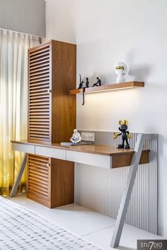 a modern desk with shelves on the wall