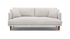 a white couch with two pillows on it