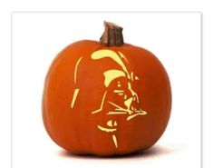 a carved pumpkin with a darth vader face on it