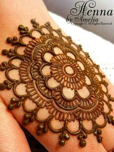 the hand is decorated with an intricate design