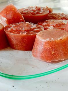 several slices of watermelon on a glass plate