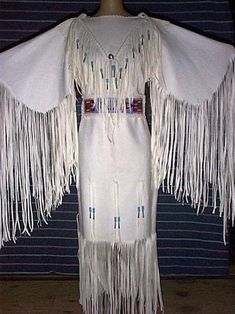 Womens White Colour Handmade Long Wedding Dress Powwow Regalia Leather Dress Native Womens Leather Maxi Native American Womens Coat Dress Features: *         100 % genuine top quality  leather. *         White color  *         Lining Material : Polyester *          Long Fringes *         Stitched work  For Your Best Fit: I Need Your Below Sizes -Neck: -Shoulder to shoulder: -Sleeves Length -Chest: **Custom orders after manufactured on demand so return or exchange is not acceptable** -------------------------- DELIVERY DETAIL -------------------------- All of our orders are made on-demand, tailored according to your measurements for a better fitting and exquisite look. Import Custom Duties and Taxes! The Buyer is fully responsible for any import customs duties and taxes in his country becau Western Jacket Women, Native American Wedding Dress, American Wedding Dress, Fringe Wedding Dress, Native American Wedding, Native American Dress, Powwow Regalia, Beaded Wedding Dress, Native Dress