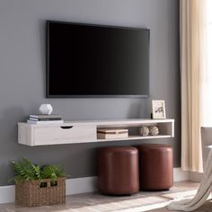 a flat screen tv mounted to the side of a wall