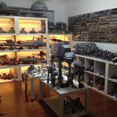 a room filled with lots of toys and shelves full of action figurines on display