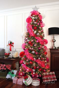 a christmas tree with pink and red decorations