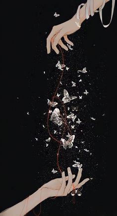 two hands reaching for something in the air with white butterflies flying around them on a black background