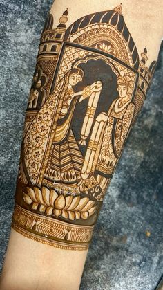 the arm is decorated with gold and black designs