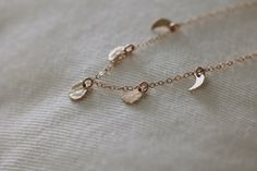 A minimalist dainty piece that you can wear every day, lovely on its own or layered with other necklaces. Each moon is unique, with the prettiest hand hammered texture. The moon phases are a sweet representation of the passage of time, and the seasons of our life waxing and waning. To me the five little moons represent my little babies, which feels especially sweet to me as I leave the baby phase and enter a new phase with them. Time is fleeting and these little moons remind me to enjoy every ch Matching Mommy Daughter, Moon Phases Necklace, Mother Rings, Mommy Daughter, Pretty Hands, Short Necklace, Moon Phases, Rose Gold Necklace, Gold Filled Chain