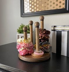 This item is a perfect organizer for all your scrunchies and hair ties. This wooden creation contains four rods with heights of 8.5 in, 7.5 in, 6.5 in, and 5.5 in. This scrunchie holder has a circular base 8 inches in diameter, is fully sealed with a non-yellowing finish, and comes with felt pads to protect your furniture or countertop. No more digging through a basket or drawer to find your favorite hair tie! Makes a great gift too! All items are handmade and may have unique imperfections! Since this is a made-to-order item, stain variation may occur. To see all the items in my shop, follow this link: https://www.etsy.com/shop/moodypixiestudio Stained Wood Scrunchie Holder- Hair Tie Holder-Scrunchie Organizer-Room Decor for Teen Girls-Rustic Finish-Handmade-Hair Accessories-Stand Porta Scrunchies, Scrunchie Organizer, Hair Tie Storage, Spanish Cottage, Hair Tie Organizer, Hair Accessories Display, Scrunchie Holder, Hair Tie Holder, Tie Holder