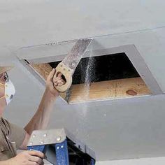 a man is working on an air duct system