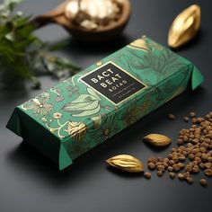 a green box with some seeds next to it