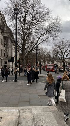 people walking down the street in london