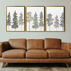 two paintings on the wall above a couch in a living room with brown leather furniture