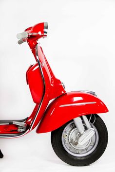 a red scooter is shown against a white background