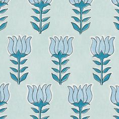 a blue flower pattern on a light green background