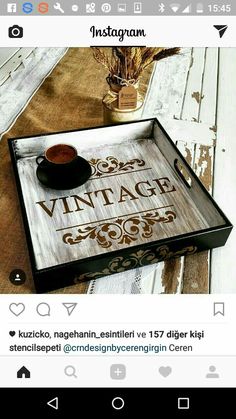 a wooden tray with a cup of coffee on it and the words vintage written in german