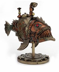 a metal sculpture of a fish with red eyes on it's head and mouth