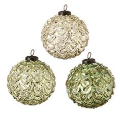 three glass ornaments hanging from the ceiling