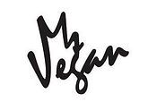 the word vegan written in black ink