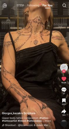 a woman with tattoos on her chest and arm